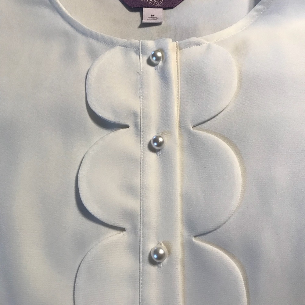 Blouse with scalloped placket & pearl buttons.